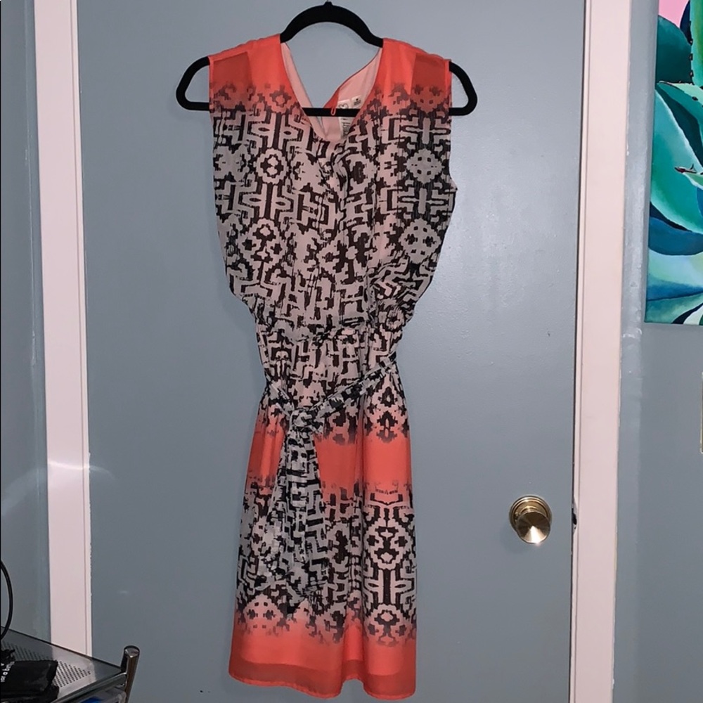 Pink, black, and white designed dress